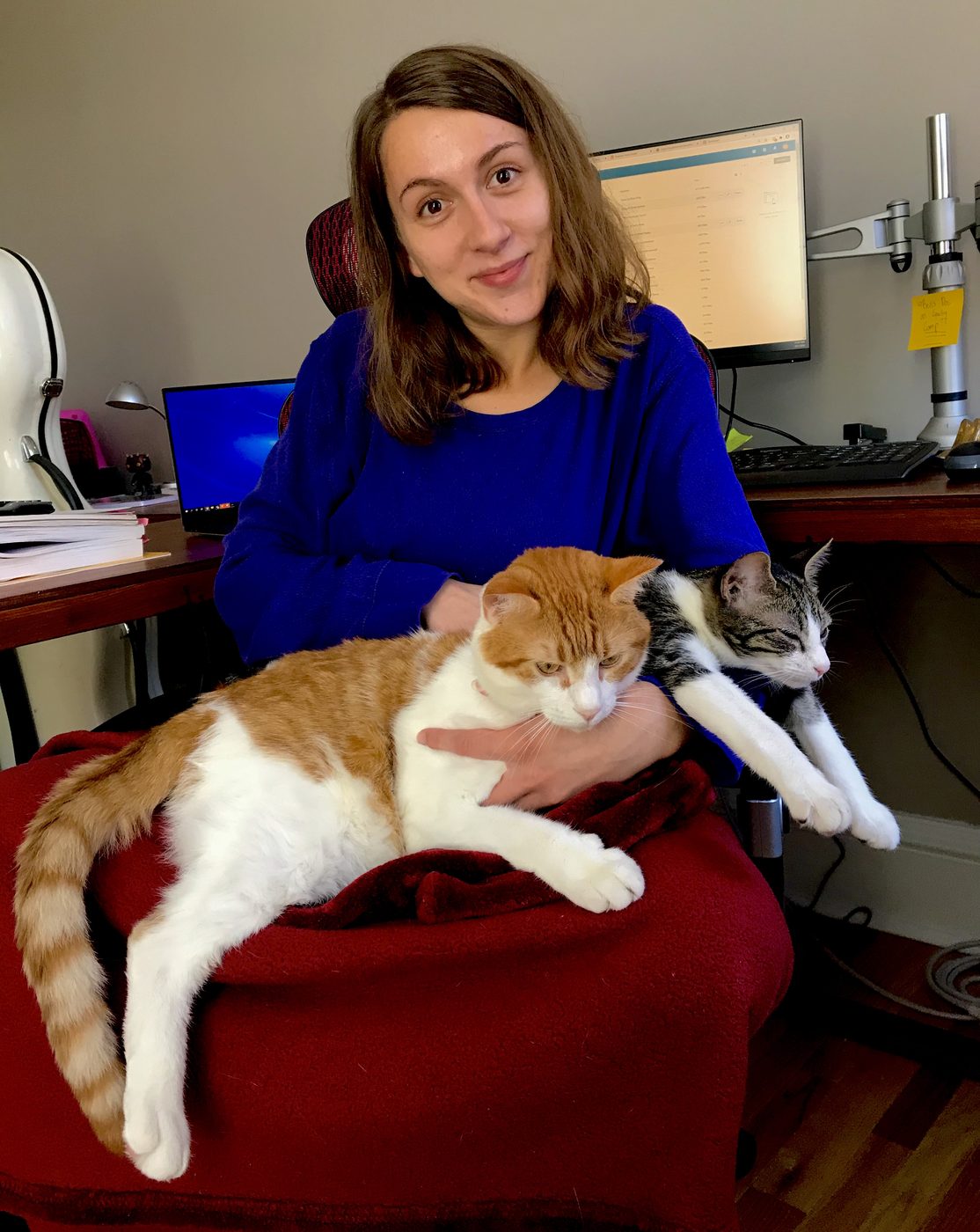 Emily at home with her two cats